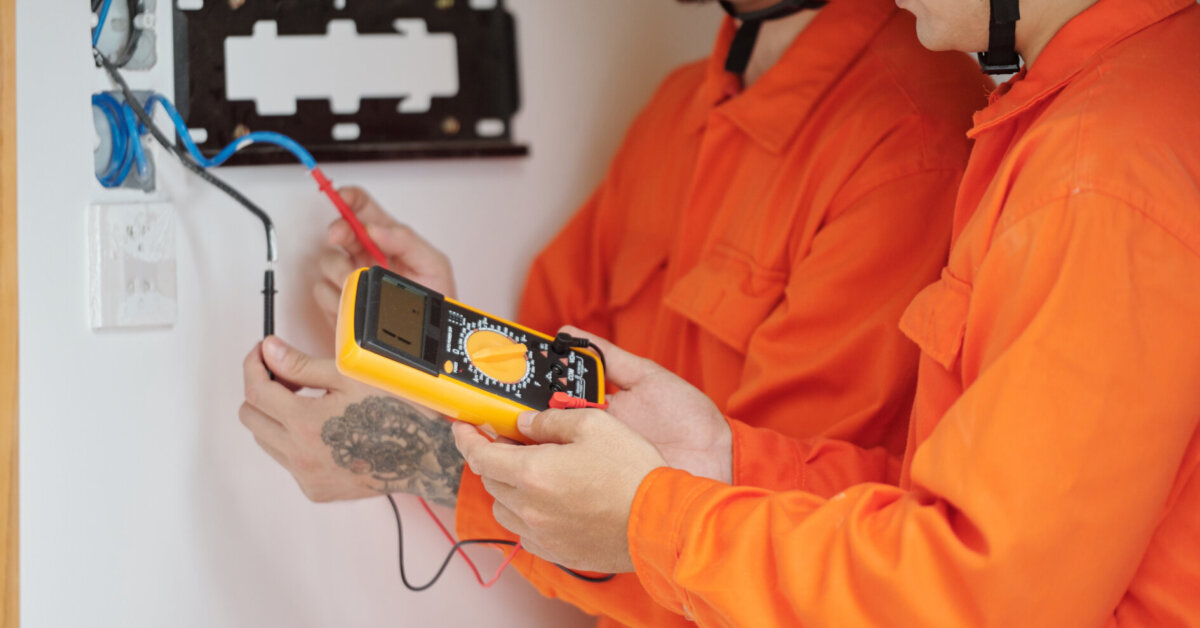 Electricians Fixing Wiring In House